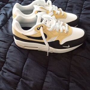 Nike Athletic Shoes in Black, White, and Gold